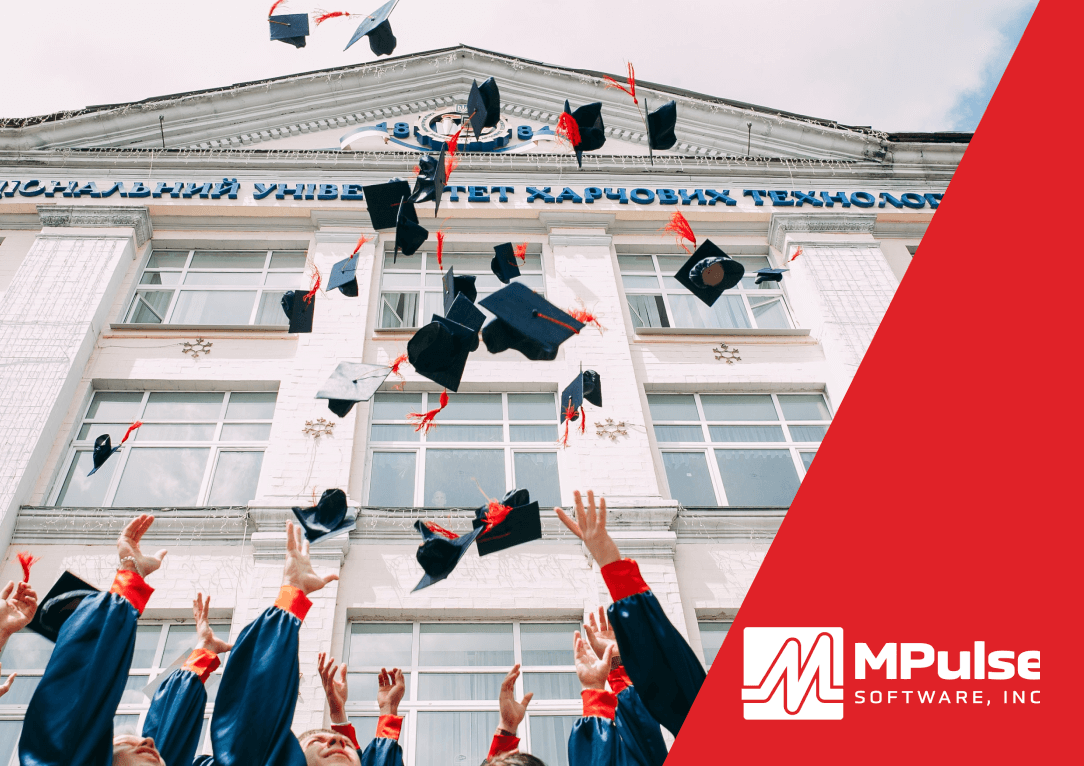 Graduate students tossing cap in the air